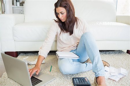 Woman calculating bills on the laptop Stock Photo - Budget Royalty-Free & Subscription, Code: 400-06801030