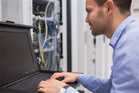 plugged in - Man repairing servers in data center Stock Photo - Budget Royalty-Free & Subscription, Code: 400-06801210