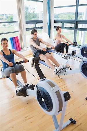 simsearch:400-06801591,k - People at the row machine at the gym Stock Photo - Budget Royalty-Free & Subscription, Code: 400-06801577
