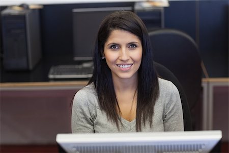 simsearch:400-07267978,k - Happy woman in computer room in college Stock Photo - Budget Royalty-Free & Subscription, Code: 400-06801776