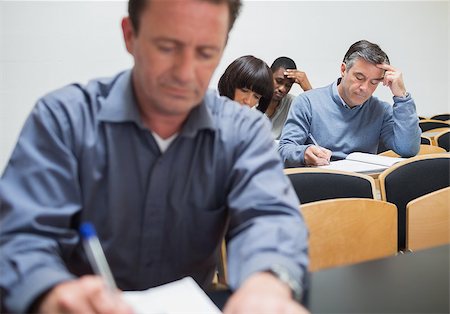 simsearch:400-06803206,k - Class taking notes in lecture Stock Photo - Budget Royalty-Free & Subscription, Code: 400-06801793