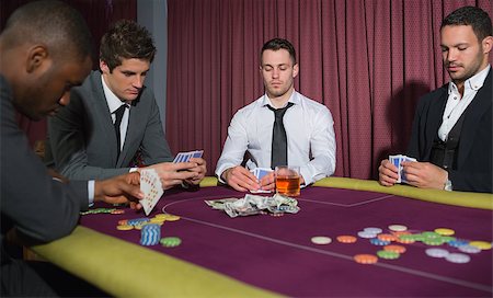 stake - Men playing high stakes game of poker in casino Stock Photo - Budget Royalty-Free & Subscription, Code: 400-06801881