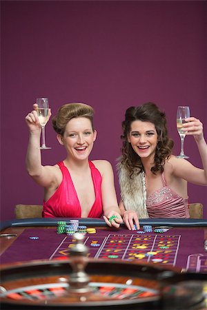 Women raising champagne glasses at roulette table in casino Stock Photo - Budget Royalty-Free & Subscription, Code: 400-06801910