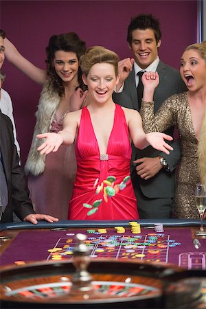 Woman winning at roulette table in casino Stock Photo - Budget Royalty-Free & Subscription, Code: 400-06801912