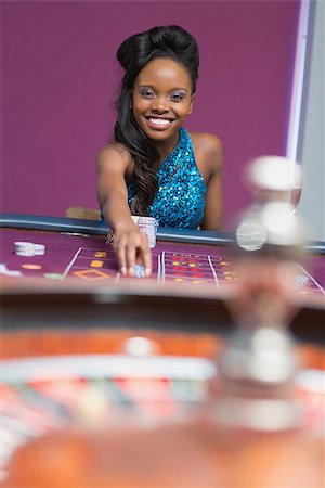 Woman playing roulette at a casino Stock Photo - Budget Royalty-Free & Subscription, Code: 400-06801935