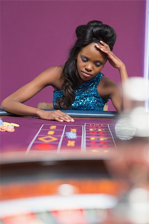 Woman looking upset at roulette table in casino Stock Photo - Budget Royalty-Free & Subscription, Code: 400-06801940