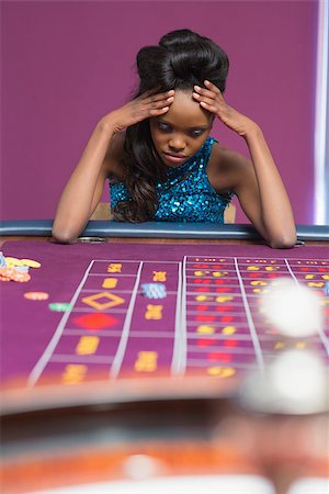 Woman losing at roulette in casino Stock Photo - Budget Royalty-Free & Subscription, Code: 400-06801941