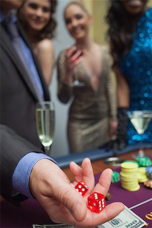 Man is throwing dice at the casino Stock Photo - Budget Royalty-Free & Subscription, Code: 400-06801978