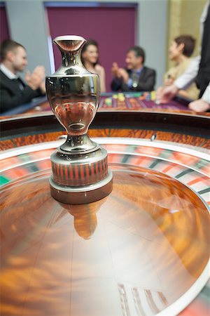 Roulette wheel spinning around in casino Stock Photo - Budget Royalty-Free & Subscription, Code: 400-06801982