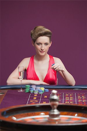 Woman playing roulette with champagne in casino Stock Photo - Budget Royalty-Free & Subscription, Code: 400-06802018