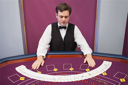 Dealer with fanned out deck of cards in casino Stock Photo - Budget Royalty-Free & Subscription, Code: 400-06802063