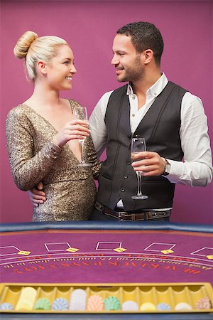 Couple drinking champagne at poker table in casino Stock Photo - Budget Royalty-Free & Subscription, Code: 400-06802082