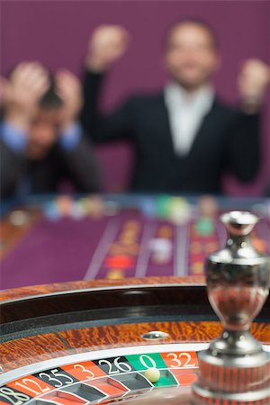 Loser and winner at roulette table in casio Stock Photo - Budget Royalty-Free & Subscription, Code: 400-06802094