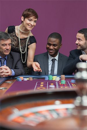 simsearch:400-06802091,k - Woman placing bet at roulette table in casino Stock Photo - Budget Royalty-Free & Subscription, Code: 400-06802096