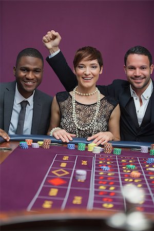 Three happy people at roulette table in casino Stock Photo - Budget Royalty-Free & Subscription, Code: 400-06802099
