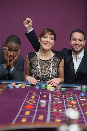 simsearch:400-06802094,k - Two winners and a loser at roulette in casino Foto de stock - Super Valor sin royalties y Suscripción, Código: 400-06802100