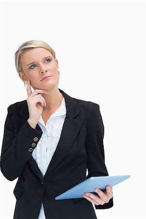 simsearch:400-06802290,k - Businesswoman looking thoughtful while holding a tablet Stock Photo - Budget Royalty-Free & Subscription, Code: 400-06802110