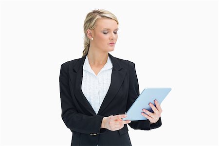 simsearch:400-06802290,k - Blonde businesswoman looking at her tablet Stock Photo - Budget Royalty-Free & Subscription, Code: 400-06802112