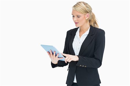 simsearch:400-06802290,k - Blonde businesswoman touching on her tablet Stock Photo - Budget Royalty-Free & Subscription, Code: 400-06802113