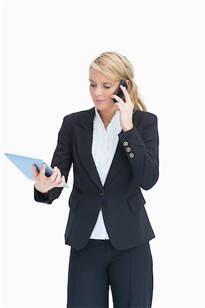 simsearch:400-06802290,k - Blonde businesswoman looking at her tablet while calling Stock Photo - Budget Royalty-Free & Subscription, Code: 400-06802142