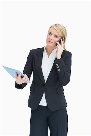 simsearch:400-06802290,k - Businesswoman using cell phone and tablet Stock Photo - Budget Royalty-Free & Subscription, Code: 400-06802143