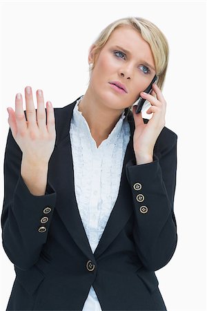 Annoyed business woman on phone Stock Photo - Budget Royalty-Free & Subscription, Code: 400-06802150