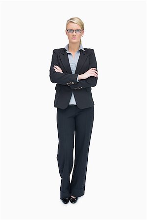 simsearch:400-06802290,k - Businesswoman standing with folded arms and cocked leg Stock Photo - Budget Royalty-Free & Subscription, Code: 400-06802269