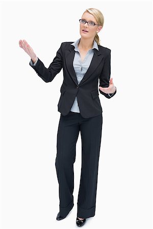 simsearch:400-06802290,k - Talking businesswoman standing wearing glasses Stock Photo - Budget Royalty-Free & Subscription, Code: 400-06802277