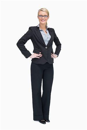 simsearch:400-06802290,k - Smiling businesswoman standing her hands on the hip Stock Photo - Budget Royalty-Free & Subscription, Code: 400-06802272