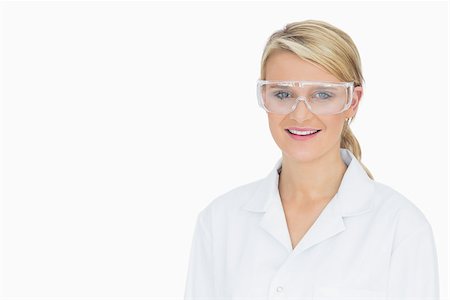 Woman smiling while wearing protective goggles Stock Photo - Budget Royalty-Free & Subscription, Code: 400-06802344