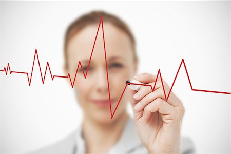 elettrocardiogramma - Businesswoman drawing red ECG line Fotografie stock - Microstock e Abbonamento, Codice: 400-06802393