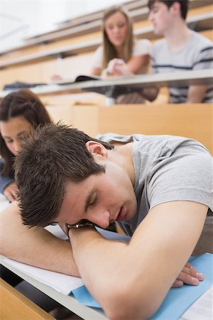 simsearch:400-06803206,k - Student sleeping at the lecture hall leaning on table Stock Photo - Budget Royalty-Free & Subscription, Code: 400-06803186