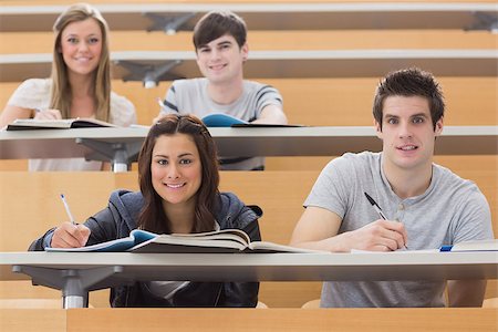 simsearch:400-06803206,k - Students sitting at the desk while smiling at the lecture hall Stock Photo - Budget Royalty-Free & Subscription, Code: 400-06803195
