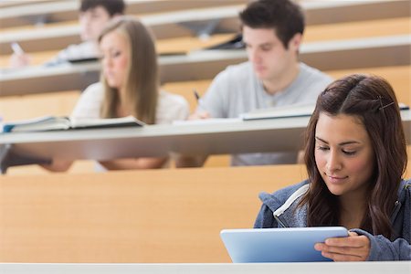 simsearch:400-06803206,k - Student using tablet pc to take notes in lecture hall Stock Photo - Budget Royalty-Free & Subscription, Code: 400-06803207