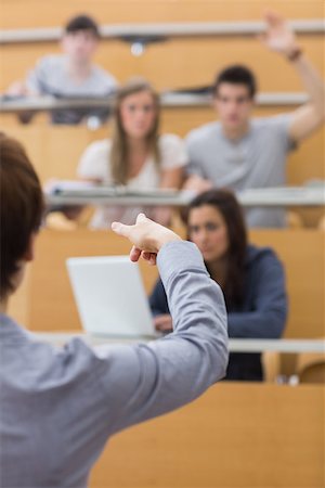 simsearch:400-06803206,k - Teacher pointing to the man at the lecture hall Stock Photo - Budget Royalty-Free & Subscription, Code: 400-06803222