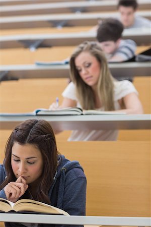 simsearch:400-06803206,k - Students sitting at the lecture hall while learning Stock Photo - Budget Royalty-Free & Subscription, Code: 400-06803240