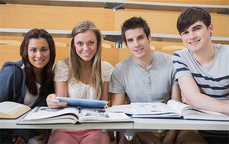 simsearch:400-06803206,k - Students sitting at the lecture hall smiling with tablet pc Stock Photo - Budget Royalty-Free & Subscription, Code: 400-06803272