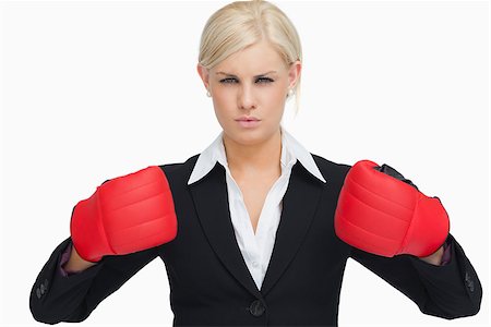 simsearch:400-06876600,k - Serious businesswoman wearing red gloves against white background Stock Photo - Budget Royalty-Free & Subscription, Code: 400-06803444