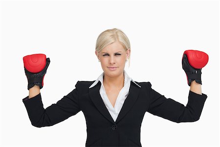 simsearch:400-06876600,k - Serious businesswoman with red gloves arms raised against white background Stock Photo - Budget Royalty-Free & Subscription, Code: 400-06803447