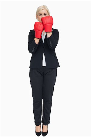 simsearch:400-06876600,k - Blonde businesswoman with red gloves against white background Stock Photo - Budget Royalty-Free & Subscription, Code: 400-06803448