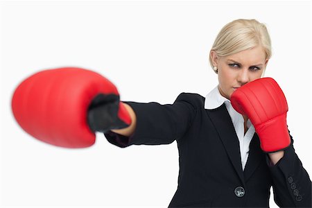 simsearch:400-06876600,k - Blonde businesswoman with red gloves fighting against white background Stock Photo - Budget Royalty-Free & Subscription, Code: 400-06803449