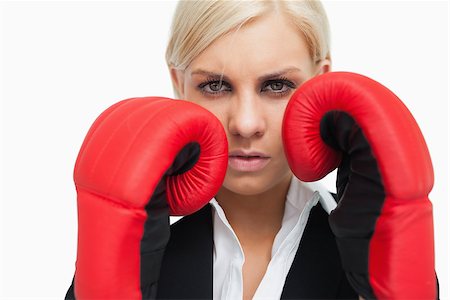 simsearch:400-06876600,k - Serious blonde woman with red gloves fighting against white background Stock Photo - Budget Royalty-Free & Subscription, Code: 400-06803454