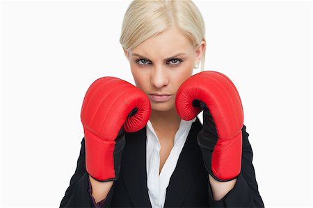 simsearch:400-06876600,k - Combative woman with red gloves fighting against white background Stock Photo - Budget Royalty-Free & Subscription, Code: 400-06803456