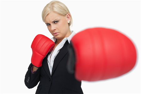 simsearch:400-06876600,k - Serious businesswoman with red gloves fighting against white background Stock Photo - Budget Royalty-Free & Subscription, Code: 400-06803452