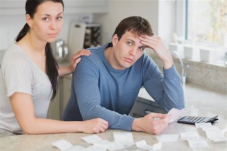 Couple getting stressed over bills in kitchen Stock Photo - Budget Royalty-Free & Subscription, Code: 400-06803522