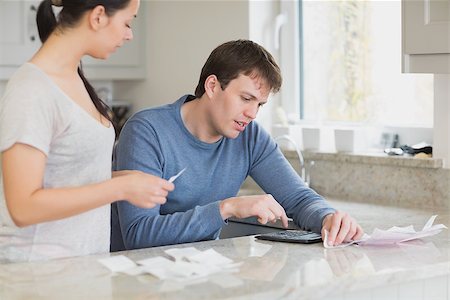 Two people calculating and helping each other in the kitchen Stock Photo - Budget Royalty-Free & Subscription, Code: 400-06803523