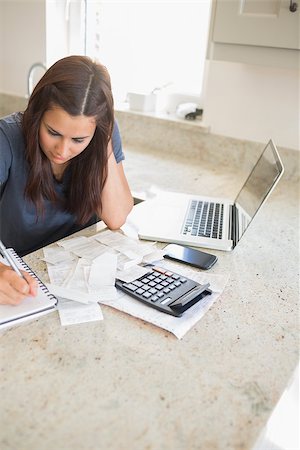 simsearch:400-06803524,k - Woman calculating finances in kitchen Stock Photo - Budget Royalty-Free & Subscription, Code: 400-06803662