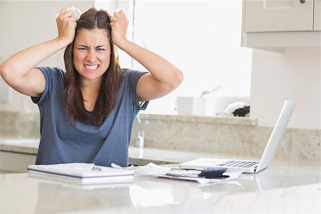 simsearch:400-06803524,k - Woman getting frustrated over bills in kitchen Stock Photo - Budget Royalty-Free & Subscription, Code: 400-06803671