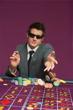 Man throwing chips on roulette table in casino Stock Photo - Budget Royalty-Free & Subscription, Code: 400-06803723