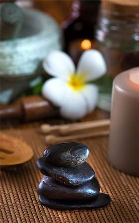 flame lily - hot stone massage with spa treatment items on the background Stock Photo - Budget Royalty-Free & Subscription, Code: 400-06847697